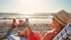 Family enjoying time on the beach after purchasing a home in the Seaside Park real estate market